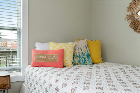 Beach life pillows on the queen bed