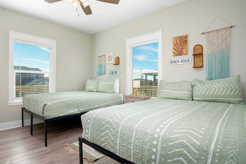 Queen beds by the window