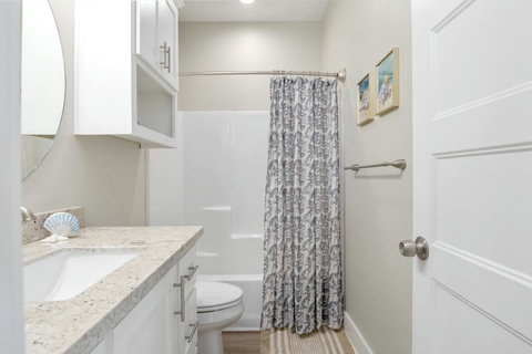 Hall bath with a tub-shower
