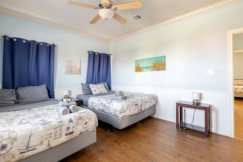 Queen beds and a ceiling fan