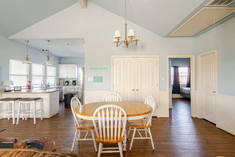 Dining table with the kitchen beside it