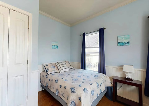Queen bed by the window