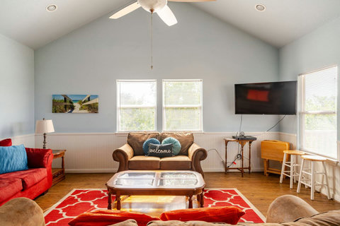 Living room with a smart TV and bar seating