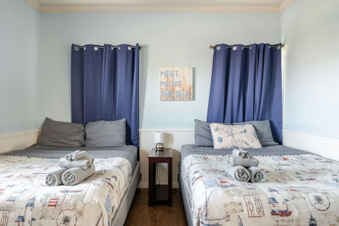 Two queen beds with nautical bedding