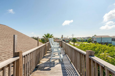 Rooftop deck with tall chairs for sunset views