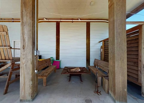 Fire pit and benches under the house