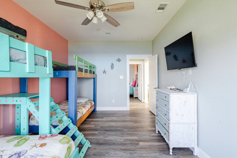 Bunk room with a TV