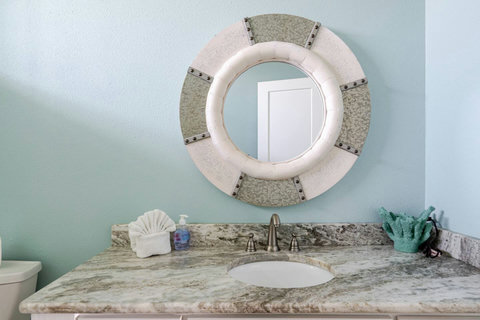 Bath vanity with a porthole mirror