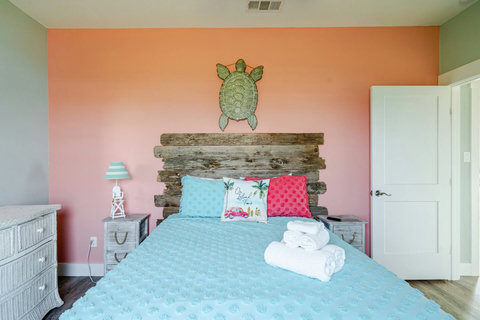 Queen bedroom with a driftwood headboard