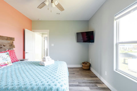 Queen bedroom with a TV