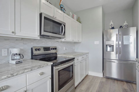 Full kitchen with a big fridge