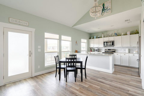 Dining table with the kitchen beyond
