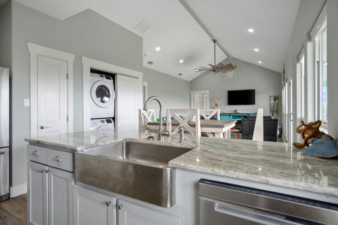 Farmhouse sink with a view of the living room