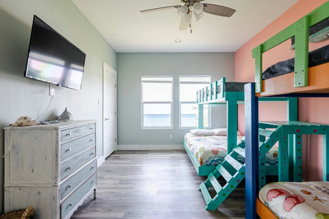 Bunk room with a dresser