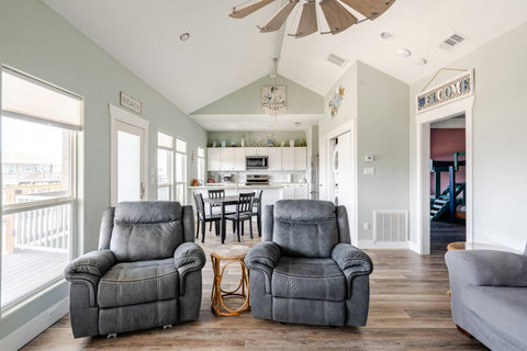 Recliners with the kitchen beyond