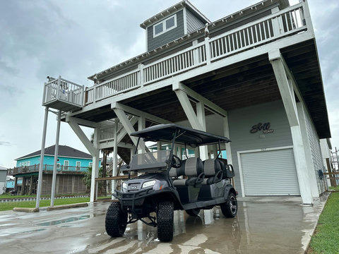 Golf cart parked under the house