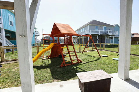 Playscape with slide and swings
