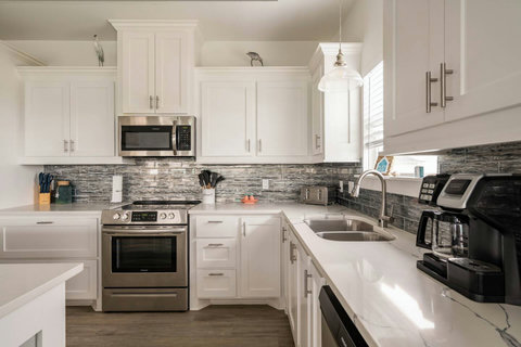Stainless range and tile backsplash