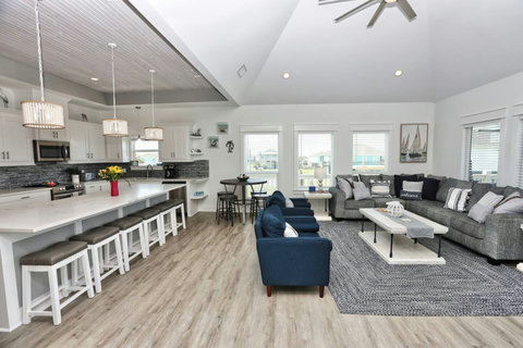 Huge open living room with a long kitchen island