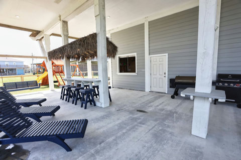Shaded patio with the tiki bar and grills