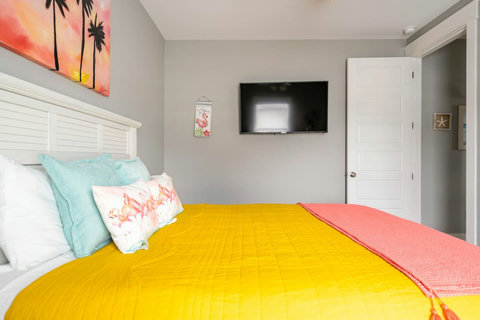 Bedroom with bright, cheerful bedding