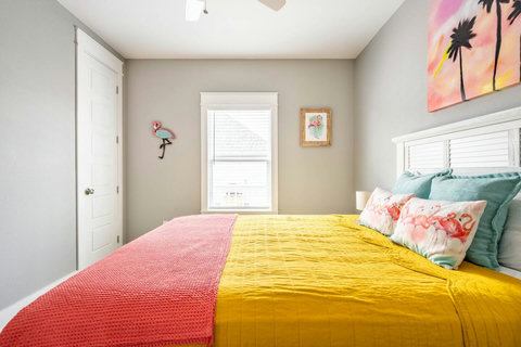 Bedroom with tropical sunset art