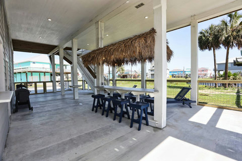 Bar seating and loungers under the house