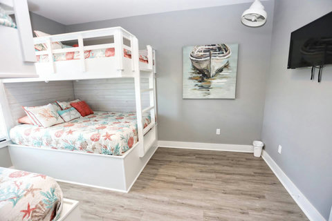 Bunk room with a TV