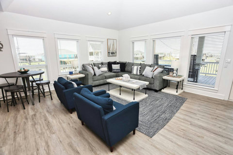 Big sectional and blue armchairs