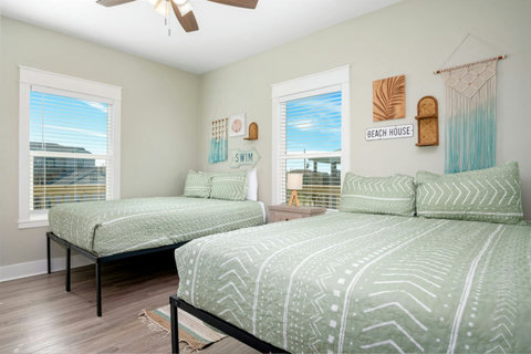 Queen beds by the window