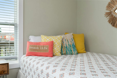 Beach life pillows on the queen bed