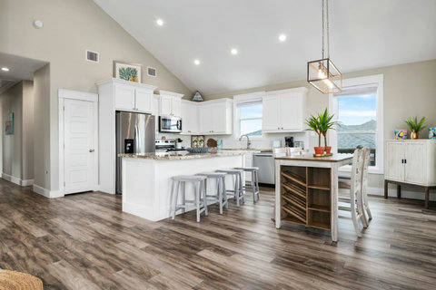 Kitchen island with bar stools and a dining table