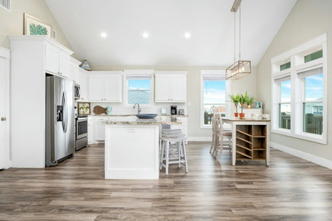 Kitchen with stainless appliances and a dining table