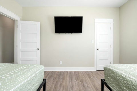Bedroom with a closet and TV