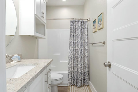 Hall bath with a tub-shower