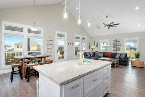 Kitchen island and dining table by the windows