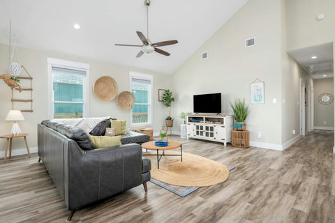 Leather sectional and plenty of natural light