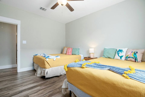 Queen beds and a ceiling fan