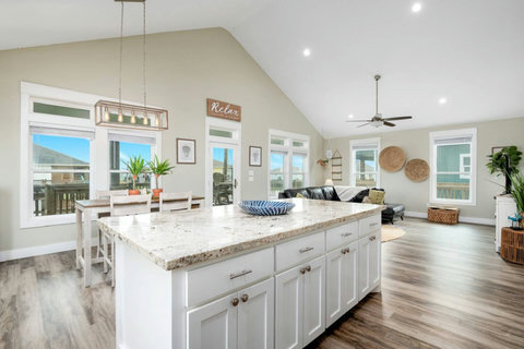 Big granite island with views of the whole room