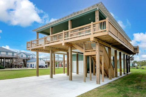 Stairs up to the deck from the patio