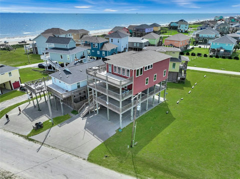 Raised beach house with parking under and beside it