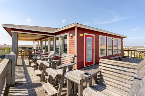 Long deck with Adirondack chairs