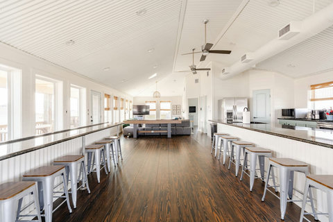 Bar seating along the windows and kitchen island