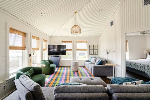 Sectional, swivel chairs and a smart TV