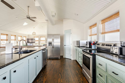 Full kitchen with a big island and pantry
