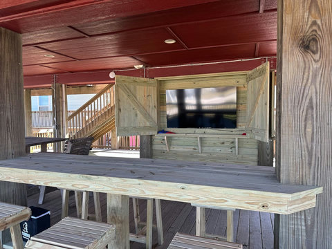 Outdoor bar with a 75-inch TV for game day