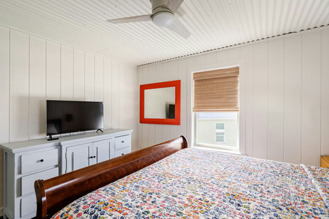 King bedroom with a TV and dresser