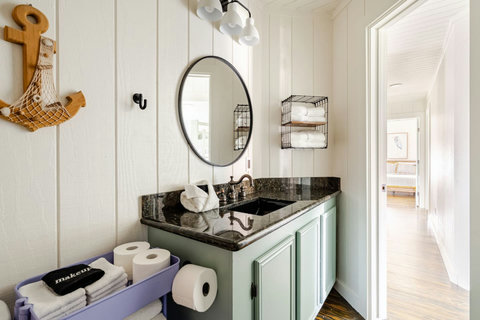 Bath vanity stocked with towels