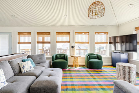 Living room with plenty of seating and natural light