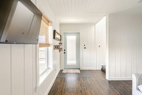Entry with a TV and storage